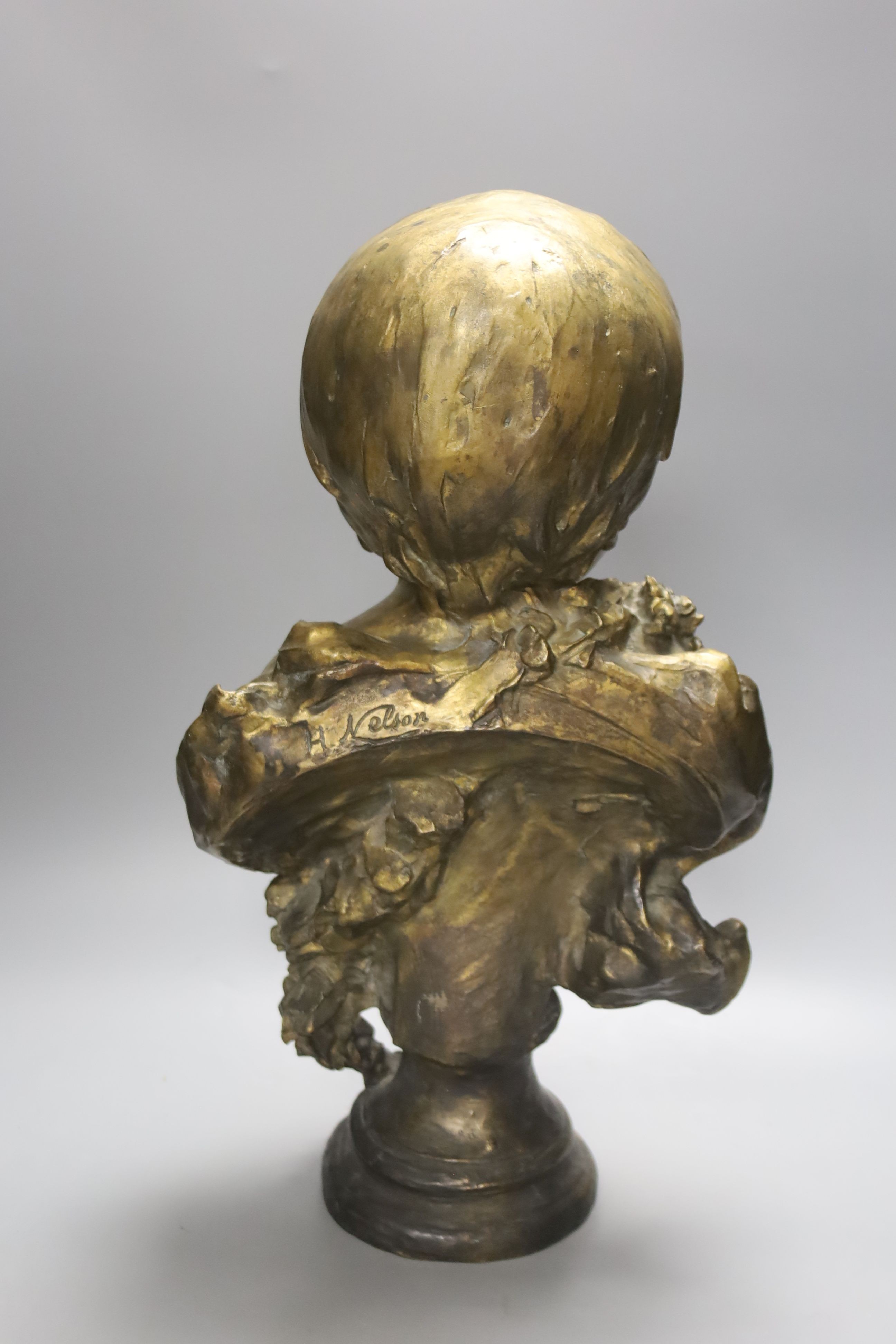 After Anton Nelson. A bronze bust of a child, height 47cm